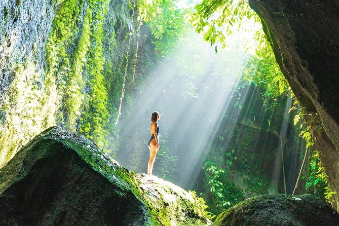 Bali Instagram: Gate of Heaven Temple Tour - Stop 3: Tukad Cepung waterfall in a cave with dramatic light